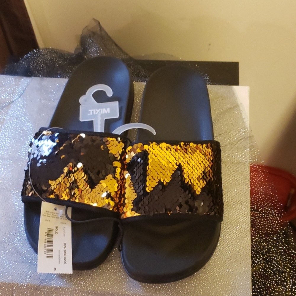 Black and gold slippers